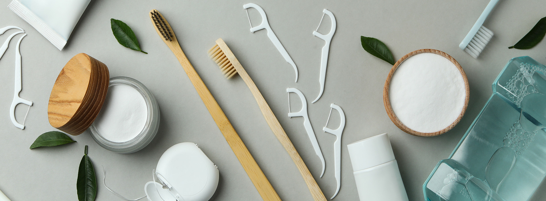 This is a composite image showing medical equipment and supplies, including a stethoscope, blood pressure cuff, tongue depressors, and other instruments, arranged in a manner that suggests they are part of a medical examination or procedure. The background is a solid color to emphasize the items.